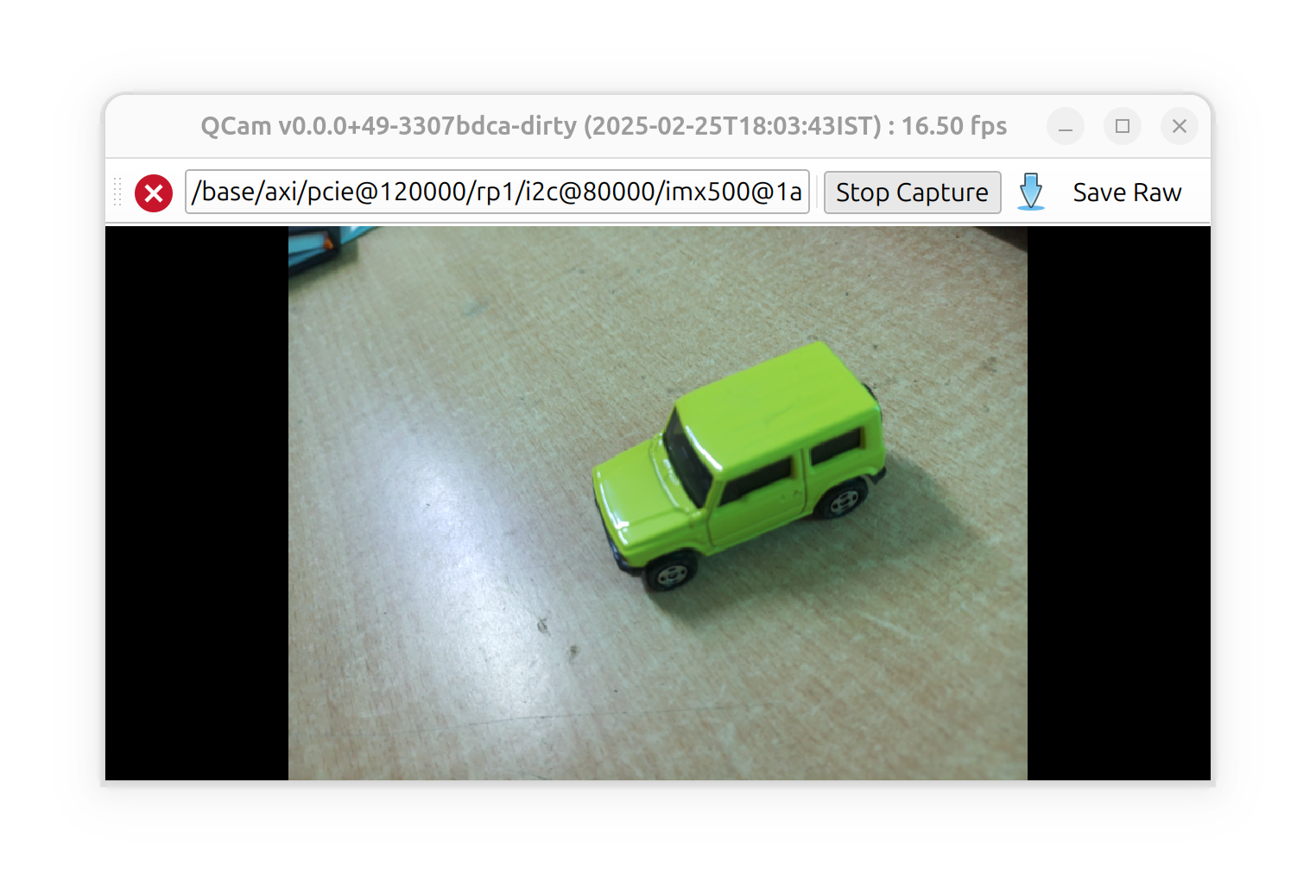 The main qcam viewfinder window, showing a preview from the camera at the bottom of the window, and a button toolbar at the top with actions to stop the preview, save stills, and a label indicating the selected camera